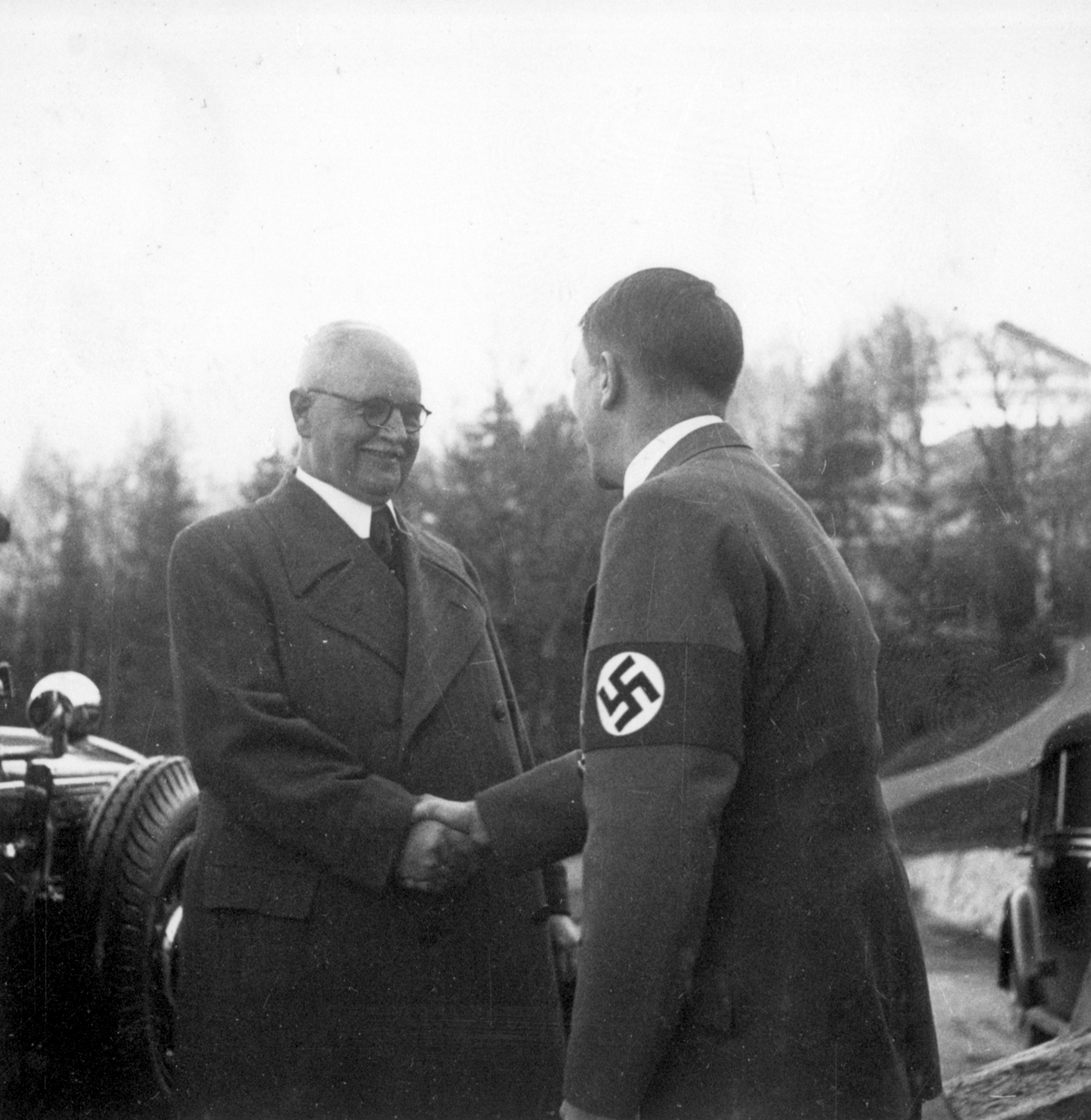 Adolf Hitler welcomes Franz Xaver Schwarz at the Berghof for his birthday, from Eva Braun's albums